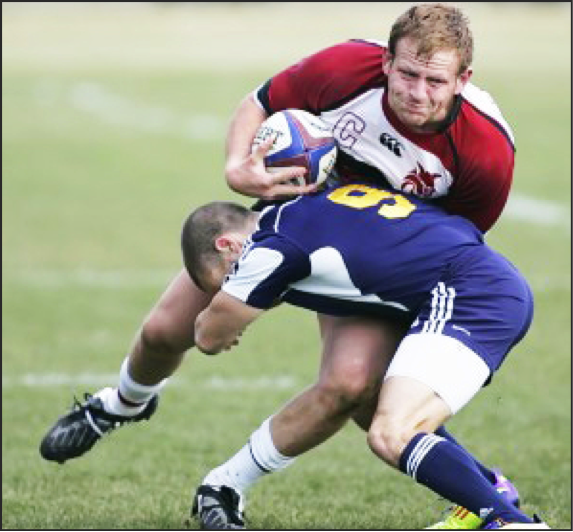 IMPACT - Blair endures a hit during his Wildcat career. (Photo by Daily Record/Courtesy of CWU Rugby)