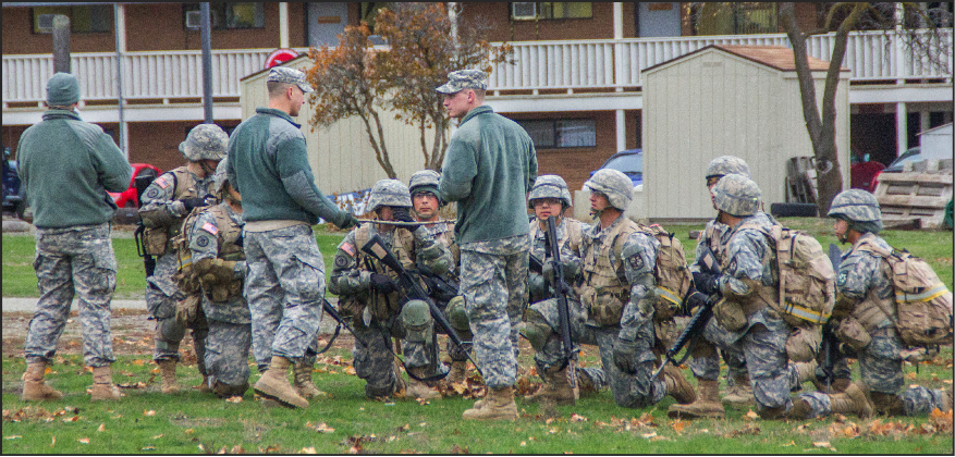AT EASE - Members of the Army ROTC meet in front of the current ROTC building, Peterson Hall.