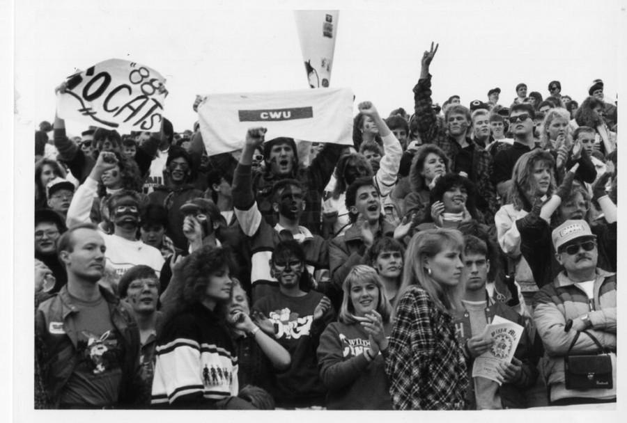 The class of 1988 cheers on the football team during the traditional homecoming game