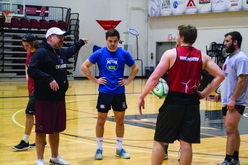 Head coach Tony Pacheco, a former Central rugby player, coaches his team during a practice this winter.