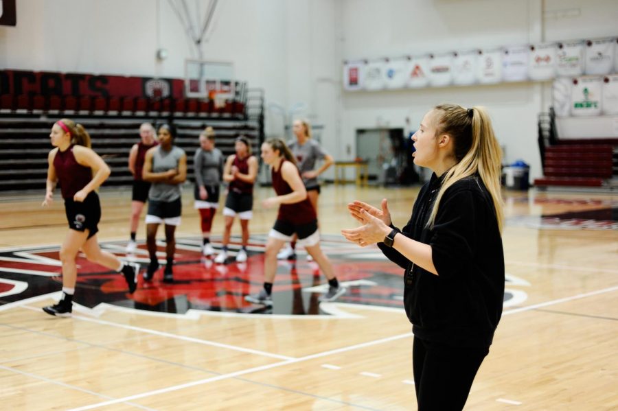 Head coach Randi Richardson-Thornley gives instruction for team drills during practice at Nicholson Pavilion.
