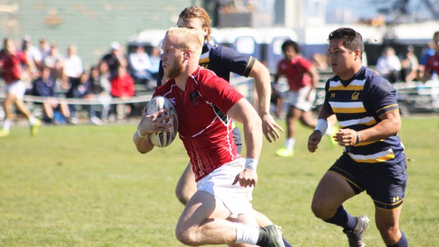 Junior Cole Zarcone charges ahead of his University of California opponents in a recent match. CWU Men’s Rugby went undefeated in the fall 7s season finishing 10-0.