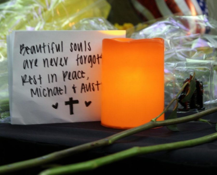 Handwritten notes rest on tables for both Austin McKenzie and Michael Demchuck. Custom-made camouflage bracelets were available for attendees to take as well. 