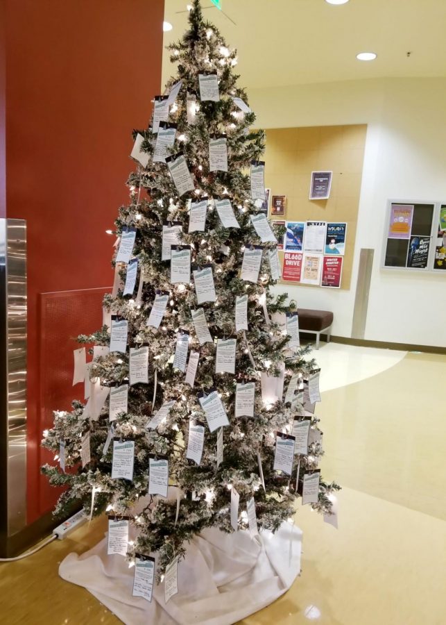 The Giving Tree is laden with cards detailing gift requests for boys and girls.