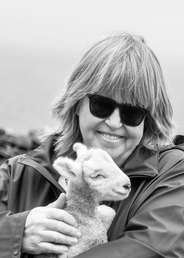 Jamie Gilbert holding a lamb in Dublin during her study abroad trip summer of 2018. 