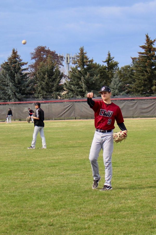 Sophomore Infielder Mitch Lesmeister warms up during practice. Soft toss gets the players arms stretched out.