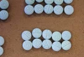 Counterfeit blue percocet pills like these often contain or are laced with fentanyl and are at the center of this epidemic (Posted by Ellensburg Police Department Facebook page)