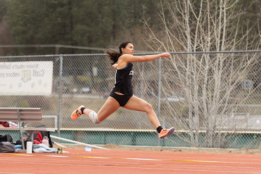 Erica Cabanos begins her triple jump attempt
