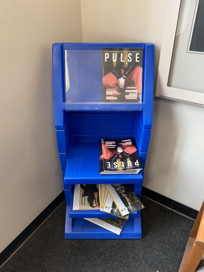 The shelf stands empty after the College of Business Dean and Associate Dean recycled copies of the paper on preview day.