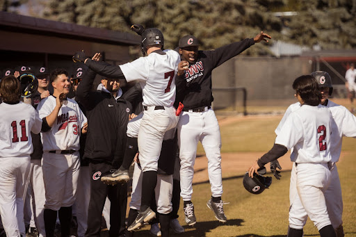 Outfielders Adam Fahsel and Divine Ayemere celebrating.