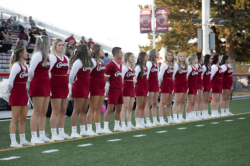 CWU Cheer team lined up on the football sidelines.