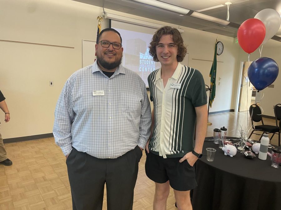 Director Cardenas (left) and Student Senate Speaker Brayden Smith (Right) conversing at welcome event. Photo by Beau Sansom