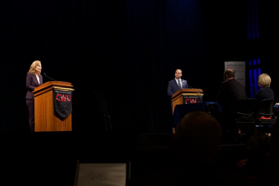 Kim Schrier (left) and Matt Larkin (right) take to the stage for the Congressional Debate. Photo by Brevin Ross.
