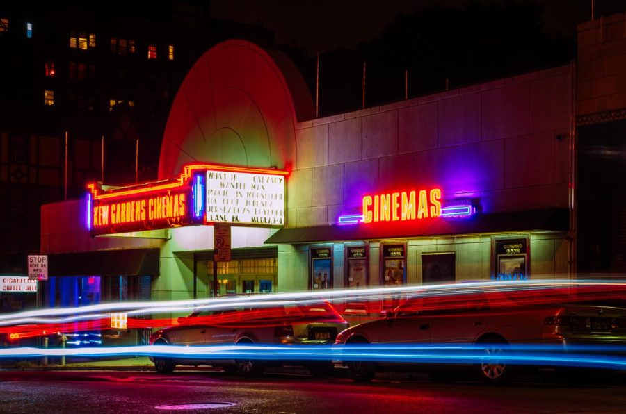 Movie theatre front at night. Photo courtesy of Pexels