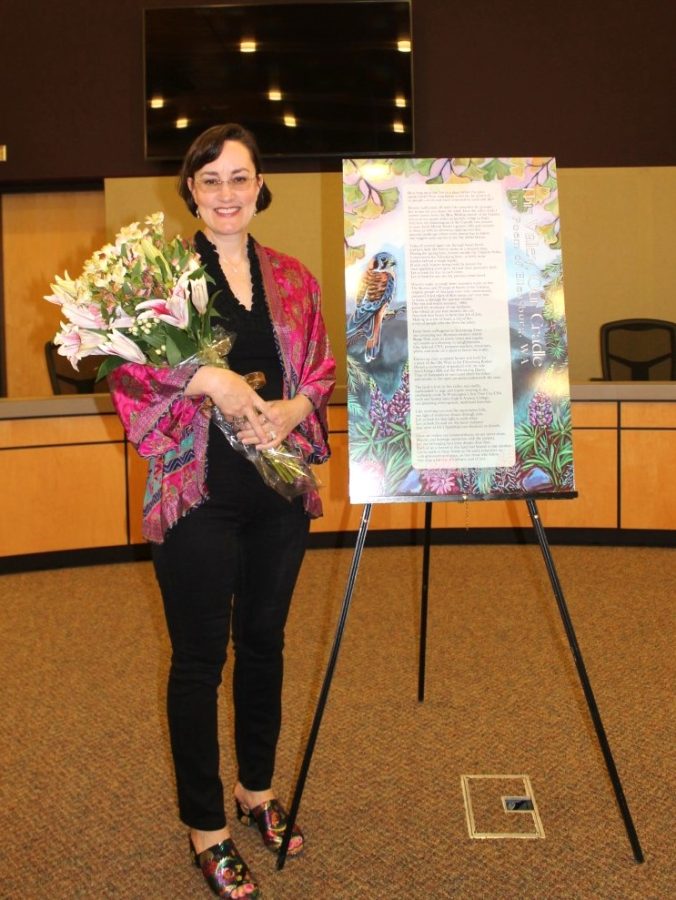 Marie Marchand poses with her Ellensburg City Poem  This Valley, Our Cradle at its unveiling. Photo courtesy of Marie Marchand
