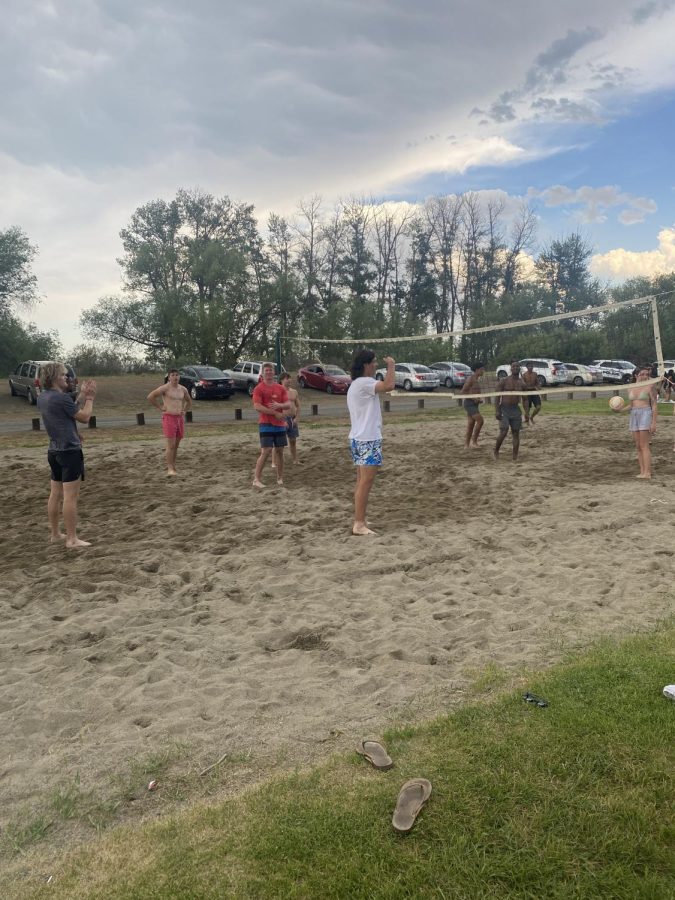 Students playing beach volleyball at The Pond, Photo by Quincy Taylor
