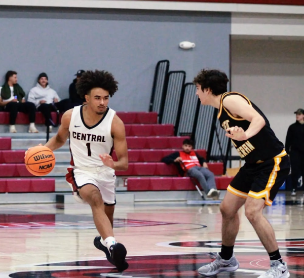 Eli Williams dribbling up the court. 