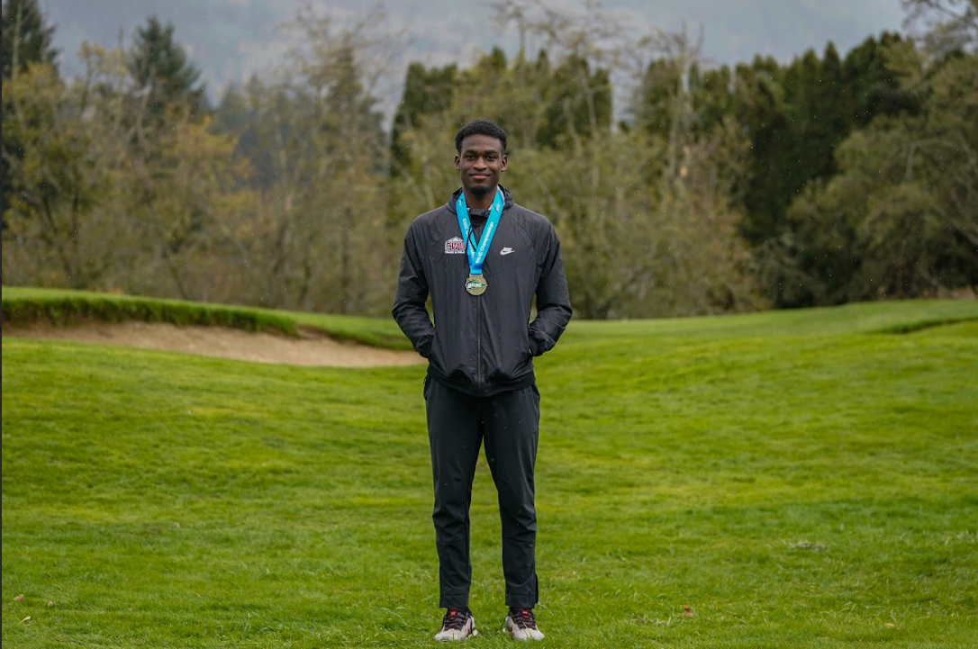 Johan Correa posing after his victory. (Photo courtesy of WWU Athletics)