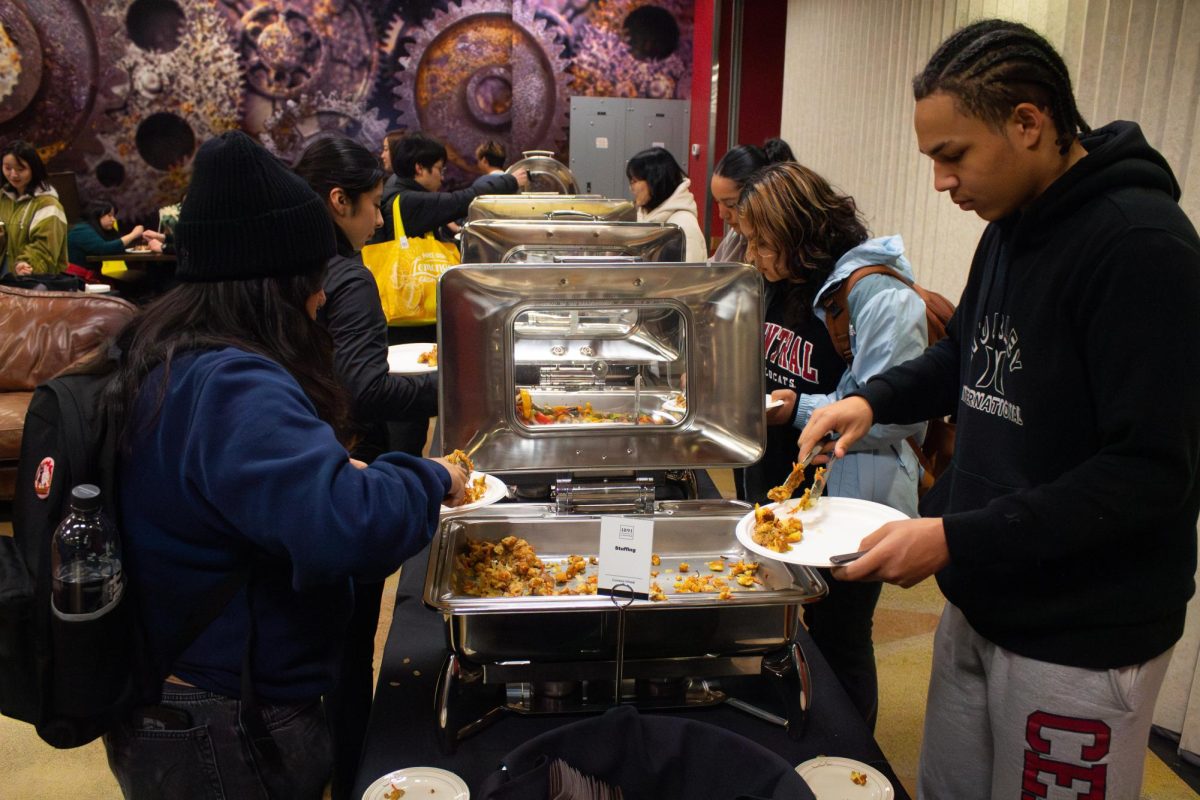 People serving themselves at the CWU Friendsgiving event.