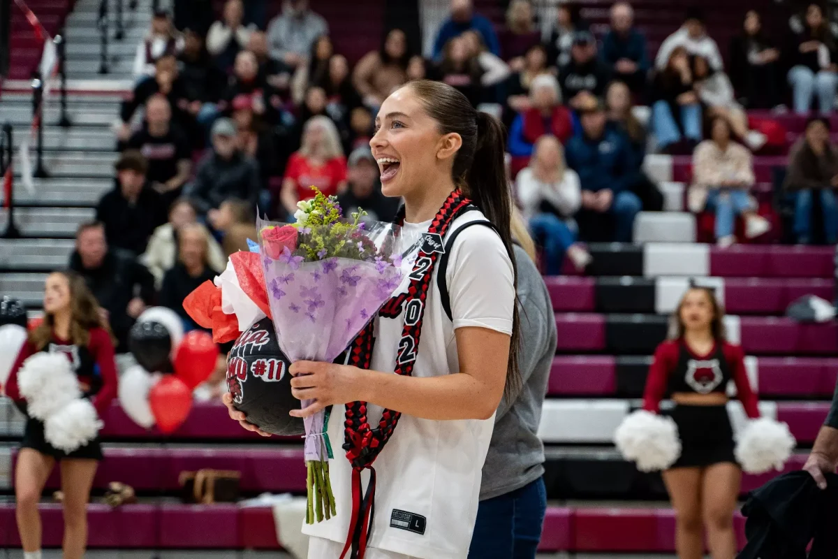 Malia Smith with flowers and gifts from loved ones.