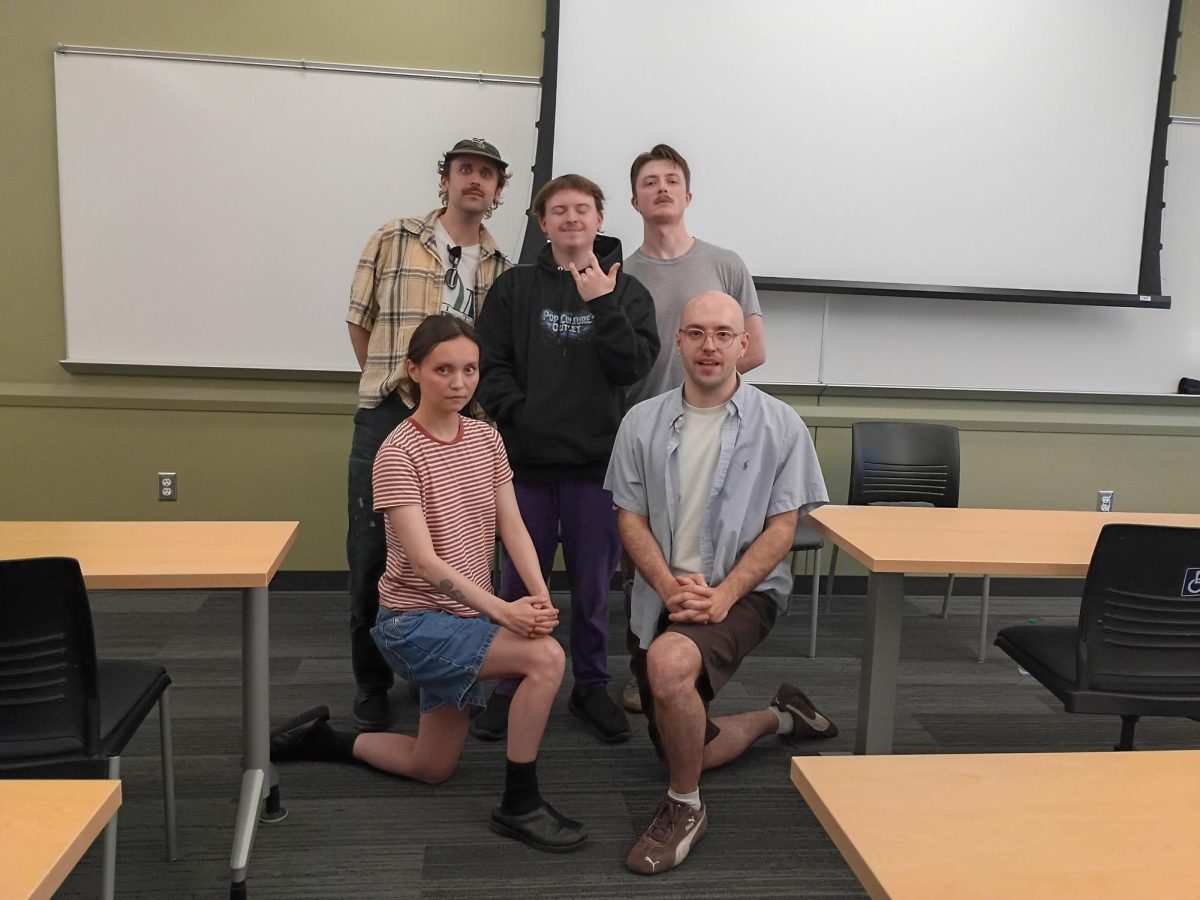 Ethan (center) with Sea Lemon and performers.